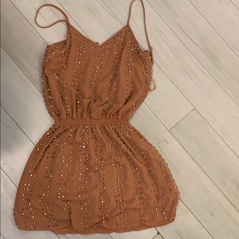 Beige mini dress with silver details all over.